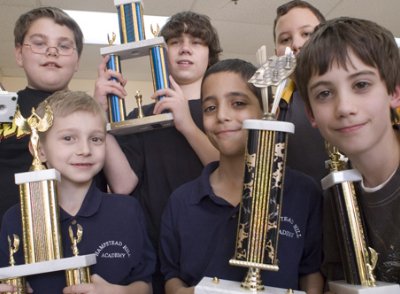 children holding trophies