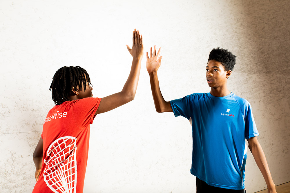 Equity_Squashwise_Students_High_Five Students High Five